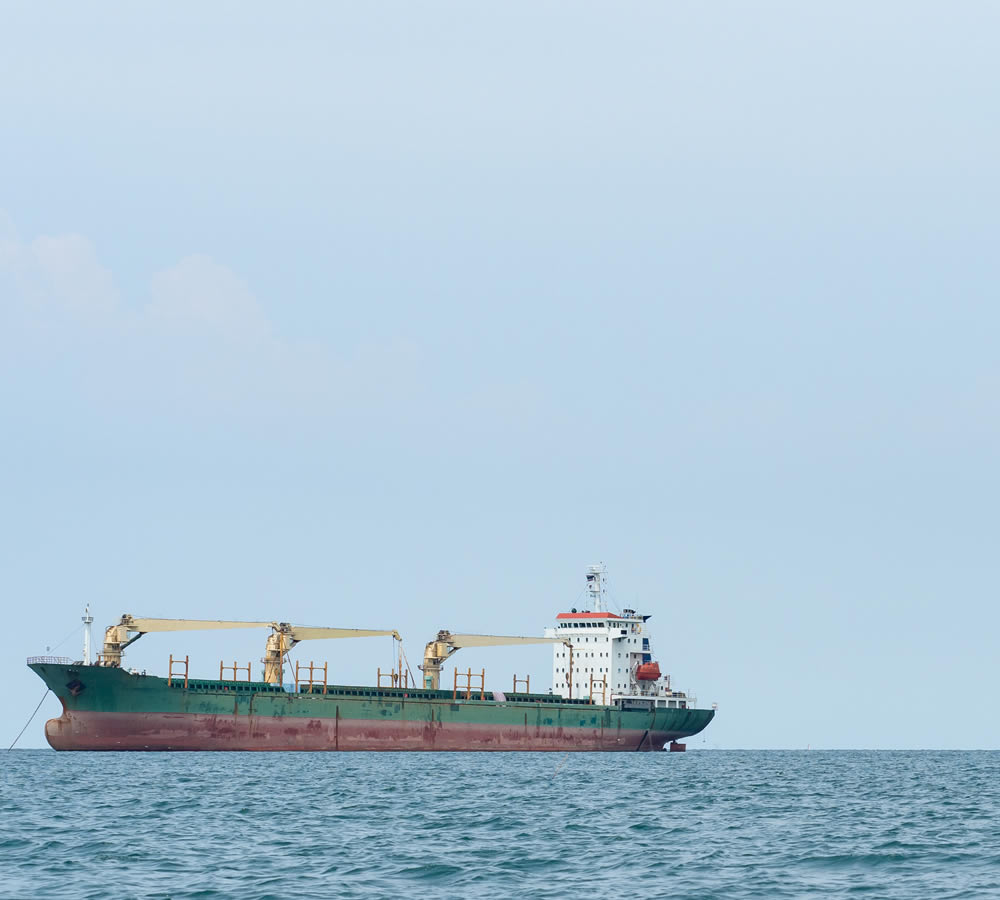 Crude,Oil,Tanker,Docked,At,A,Oil,Storage,Silo,Terminal